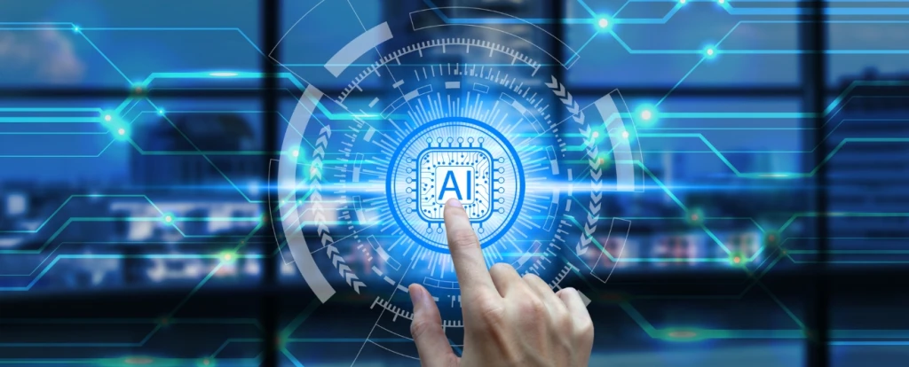 A futuristic interface with a glowing blue circular design and a microchip icon labeled 'AI' at the center. A person's finger is interacting with the interface, surrounded by digital circuit-like patterns, with a blurred cityscape visible in the background.