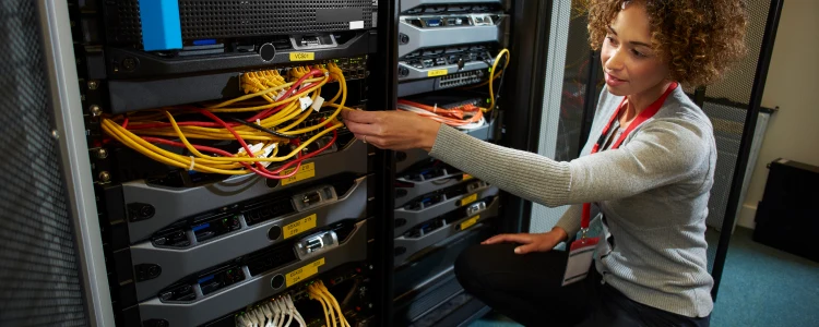 a woman plugging in dedicated servers